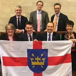 Members of Parliament for Suffolk proudly holding a Suffolk Saint Edmund's flag
